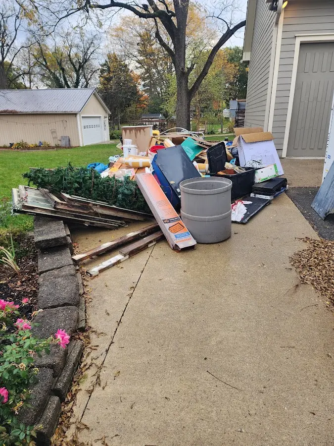 Dumpster being loaded with debris for Residential Dumpster Rental in Bay Point